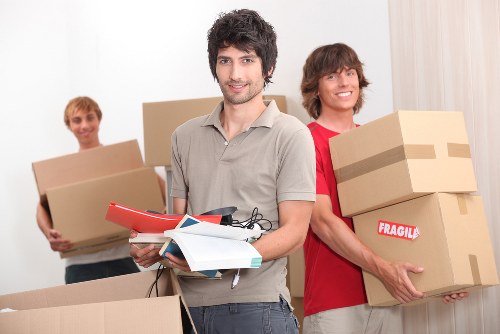 Local moving vehicle handling boxes and furniture near Westminster residential buildings