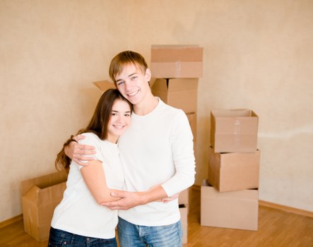 Residential moving team handling furniture in a Westminster flat