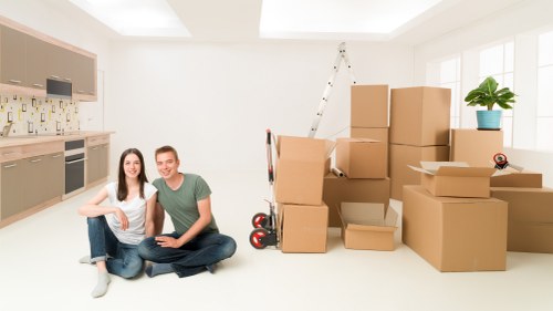 Preparation for a Westminster move with labeled boxes and furniture near a van